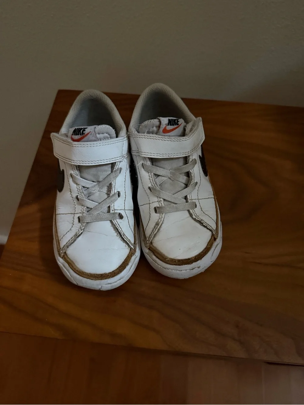 Nike Kids White Sneakers with Black Swoosh and Tan Trim